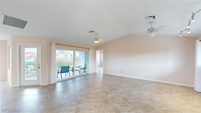 empty room featuring lofted ceiling and ceiling fan