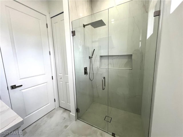 bathroom with vanity and a shower with shower door