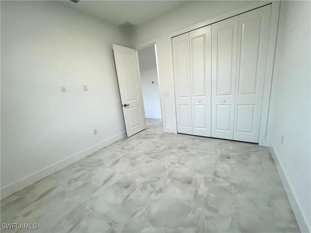 unfurnished bedroom featuring a closet