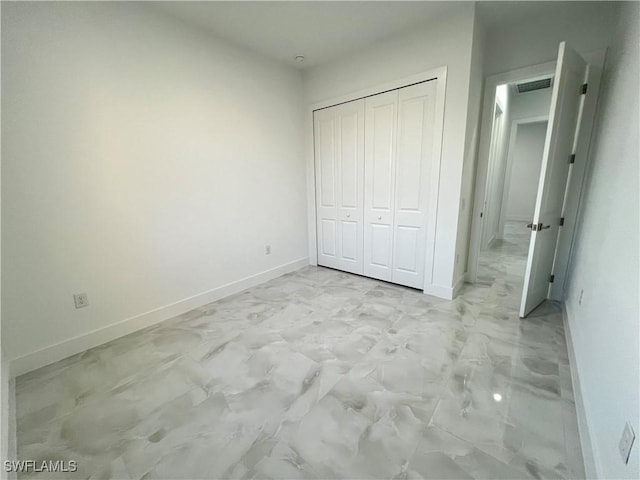 unfurnished bedroom with a closet