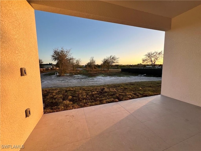 view of patio terrace at dusk