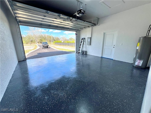 garage with a garage door opener, electric panel, and water heater