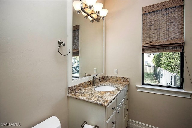 half bath with vanity and toilet