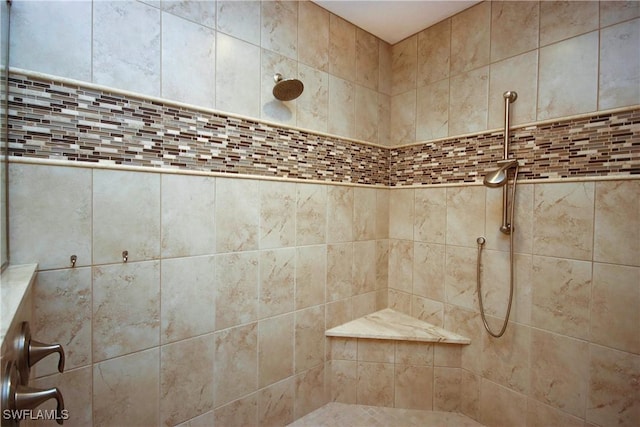 bathroom with a tile shower