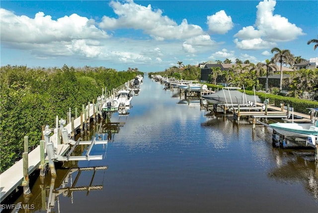 dock area with a water view and boat lift