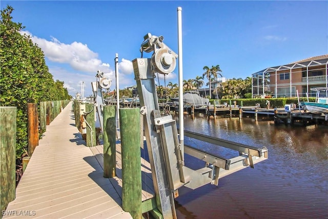 view of dock featuring a water view and boat lift