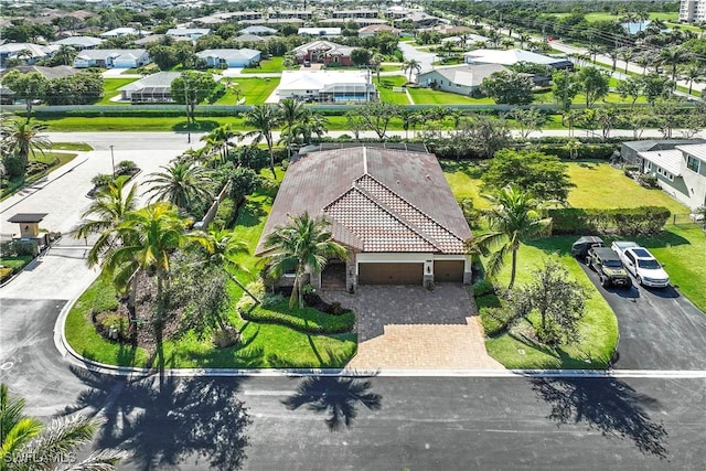 birds eye view of property with a residential view