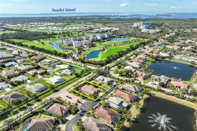 birds eye view of property featuring a water view and a residential view