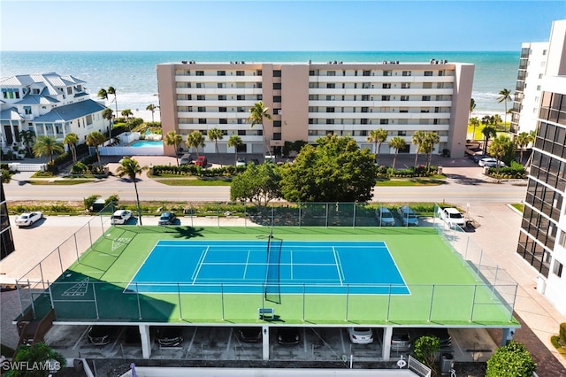 view of sport court with a water view