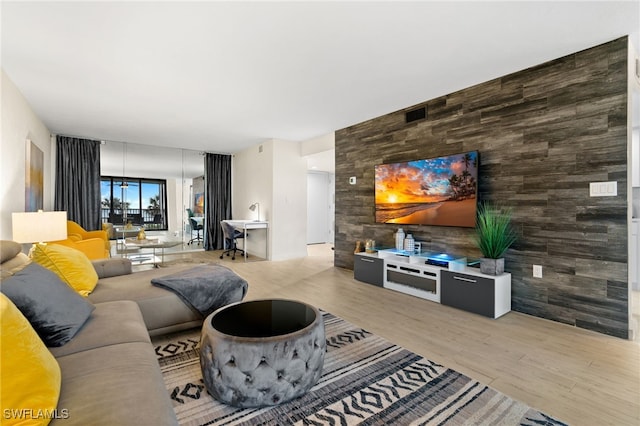 living room with light hardwood / wood-style flooring