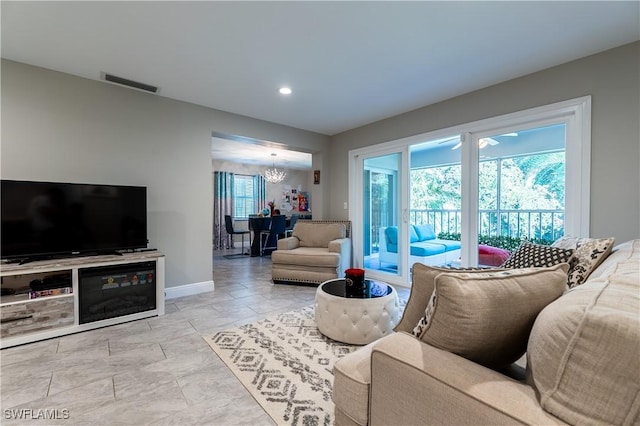 living room with a notable chandelier