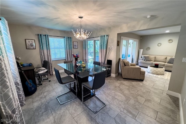 dining space featuring an inviting chandelier