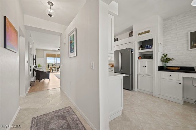 hallway featuring light tile patterned flooring