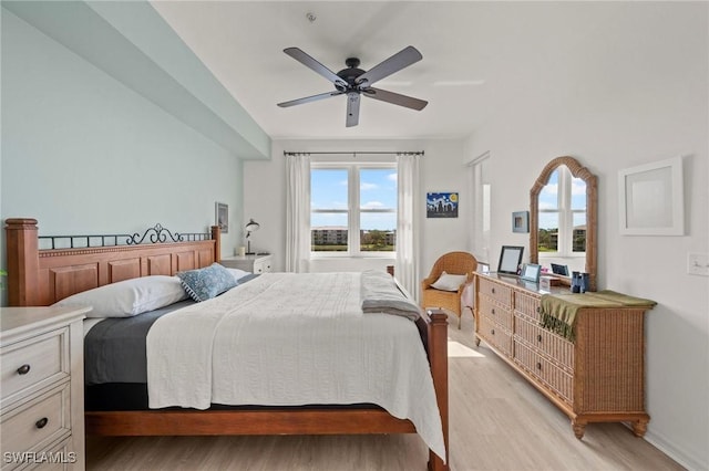 bedroom featuring ceiling fan and light hardwood / wood-style floors