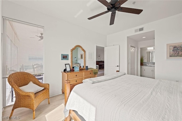 bedroom with light hardwood / wood-style flooring, connected bathroom, and ceiling fan