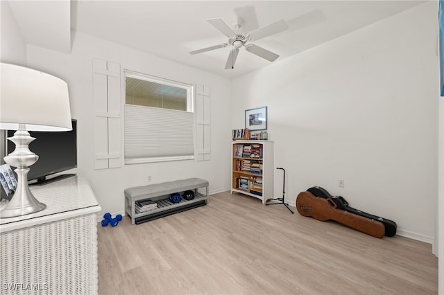 miscellaneous room with ceiling fan and light wood-type flooring