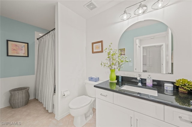 full bathroom with tile patterned floors, vanity, toilet, and shower / tub combo with curtain