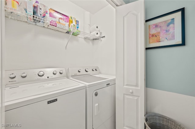 laundry area with washing machine and dryer