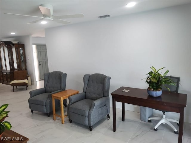 sitting room featuring ceiling fan