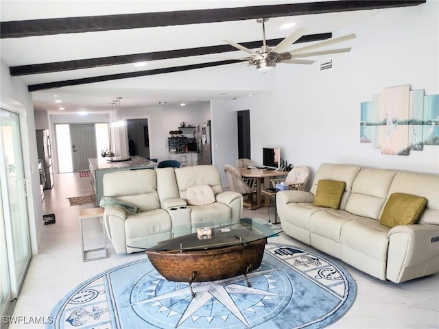 living room featuring beam ceiling and ceiling fan