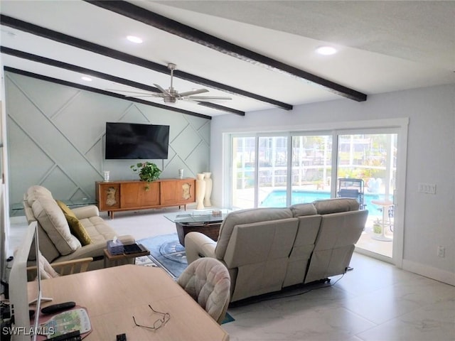 living room with ceiling fan and beam ceiling