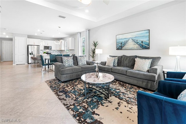 living area featuring recessed lighting, visible vents, ceiling fan, and light tile patterned floors