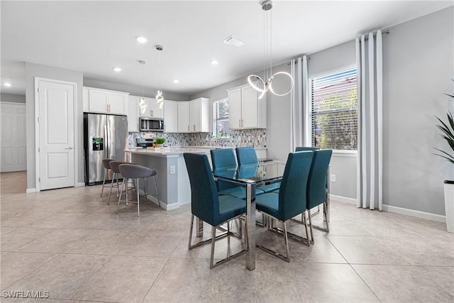 dining room featuring recessed lighting, baseboards, a wealth of natural light, and light tile patterned floors