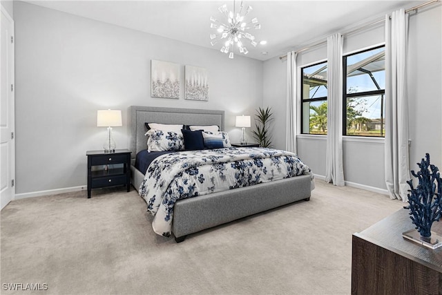 carpeted bedroom with baseboards and a notable chandelier