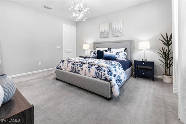 carpeted bedroom with baseboards, a chandelier, and visible vents