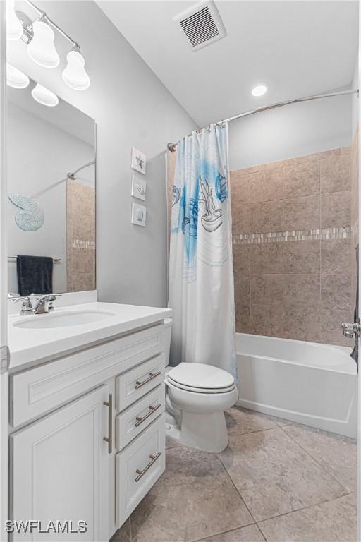 bathroom with shower / bath combo, toilet, visible vents, tile patterned flooring, and vanity
