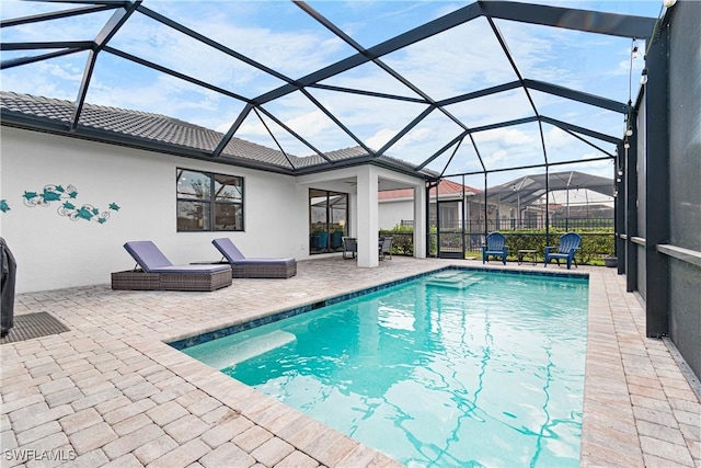 outdoor pool featuring a lanai and a patio