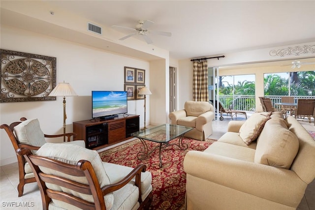 tiled living room featuring ceiling fan