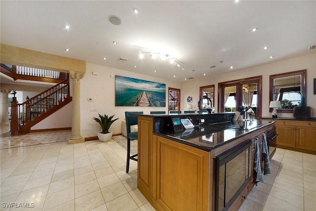 reception with french doors, visible vents, and stairway