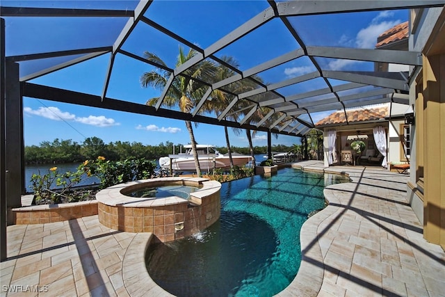 view of patio / terrace with a lanai, a water view, and a pool with connected hot tub