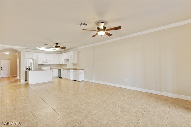 unfurnished living room with crown molding, ceiling fan, and light tile patterned flooring