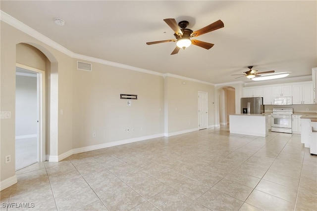 unfurnished living room featuring visible vents, crown molding, ceiling fan, baseboards, and arched walkways