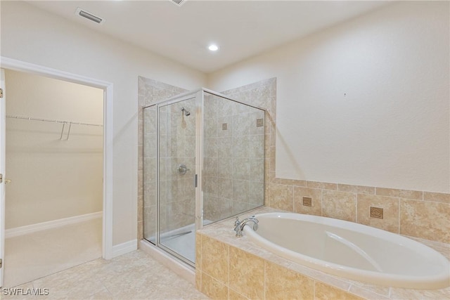 bathroom featuring separate shower and tub and tile patterned floors