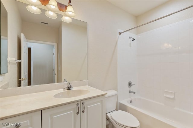 full bathroom with vanity, toilet, and tiled shower / bath