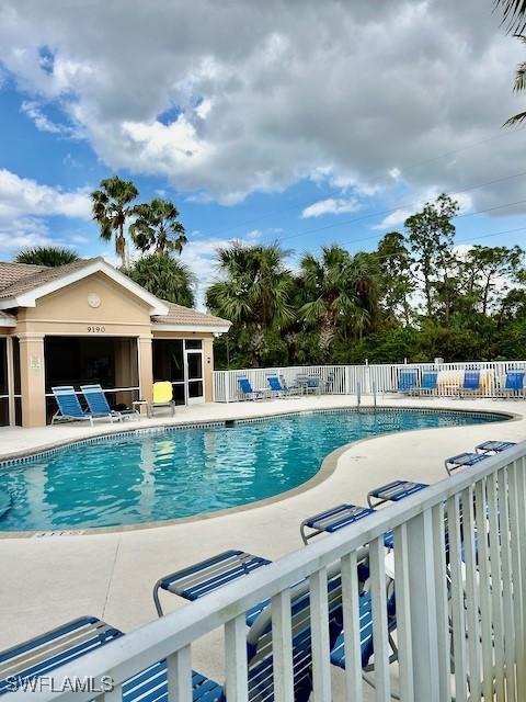 9621 Spanish Moss Way Unit 3813, Bonita Springs, FL 34135 - community pool featuring a patio