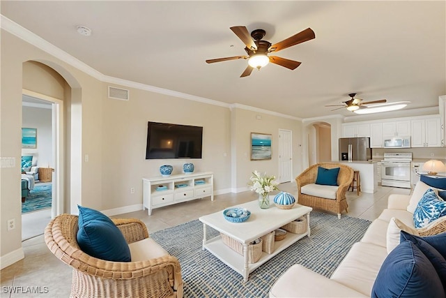 9621 Spanish Moss Way Unit 3813, Bonita Springs, FL 34135 - living area with arched walkways, ceiling fan, light tile patterned floors, crown molding, and baseboards
