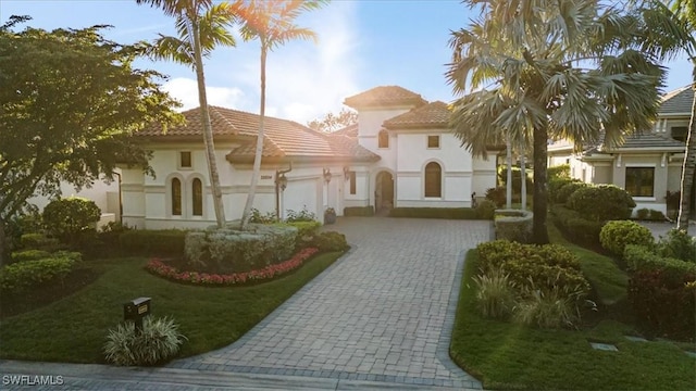 exterior space featuring a garage and a front yard