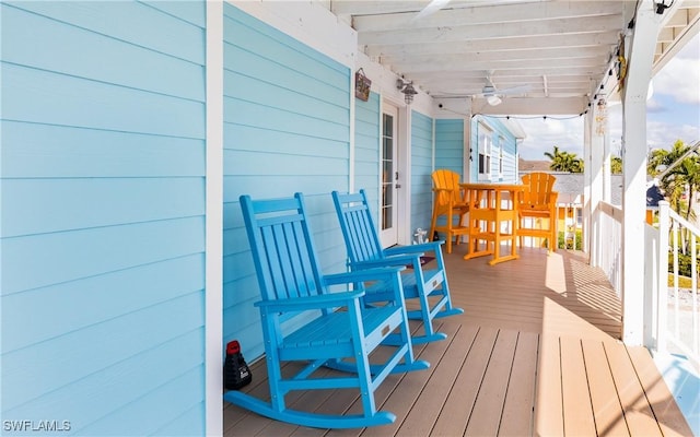 wooden terrace featuring covered porch