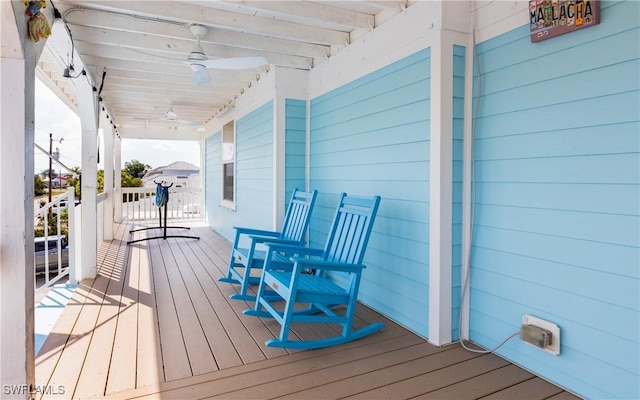 deck with ceiling fan and a porch