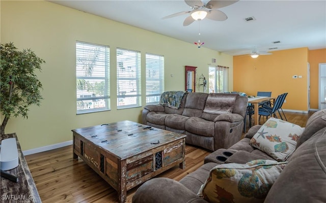 living room with hardwood / wood-style floors and ceiling fan