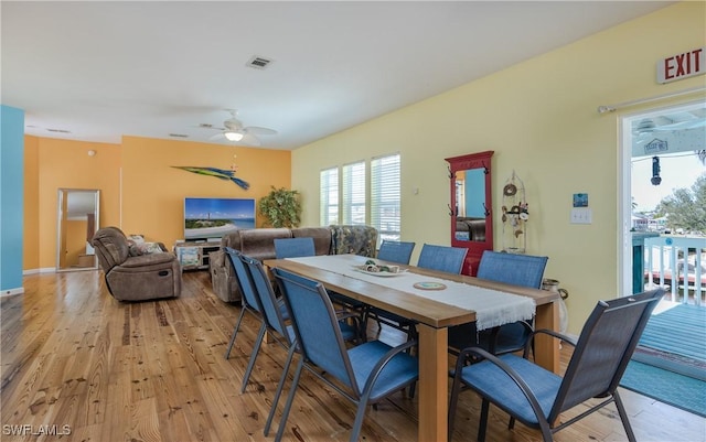 dining space featuring light hardwood / wood-style flooring and ceiling fan