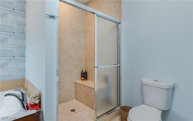 bathroom with toilet and walk in shower