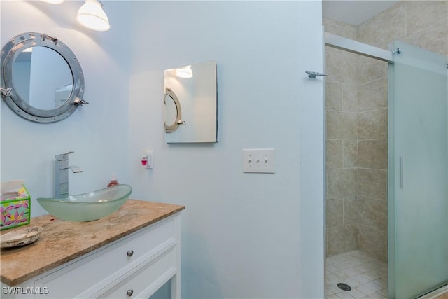 bathroom featuring walk in shower and vanity