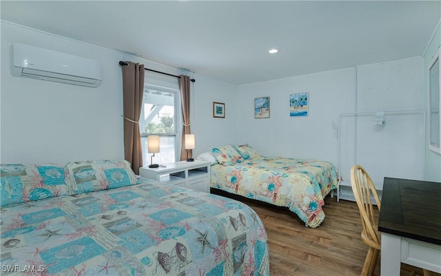 bedroom featuring dark wood-type flooring and a wall mounted air conditioner