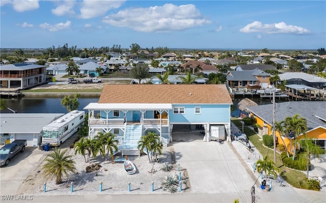 drone / aerial view featuring a water view