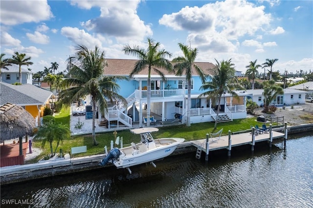 rear view of house with a water view